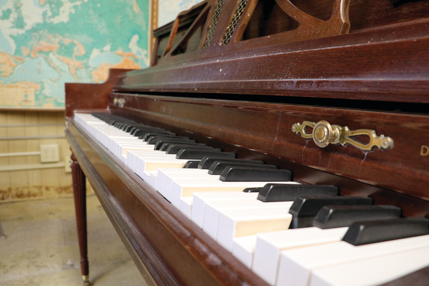 A piano in the music room reveals sunken keys from hot water damage caused by a pipe that burst in the girl’s lavatory over Thanksgiving weekend causing extensive damage to St. Kevin School.